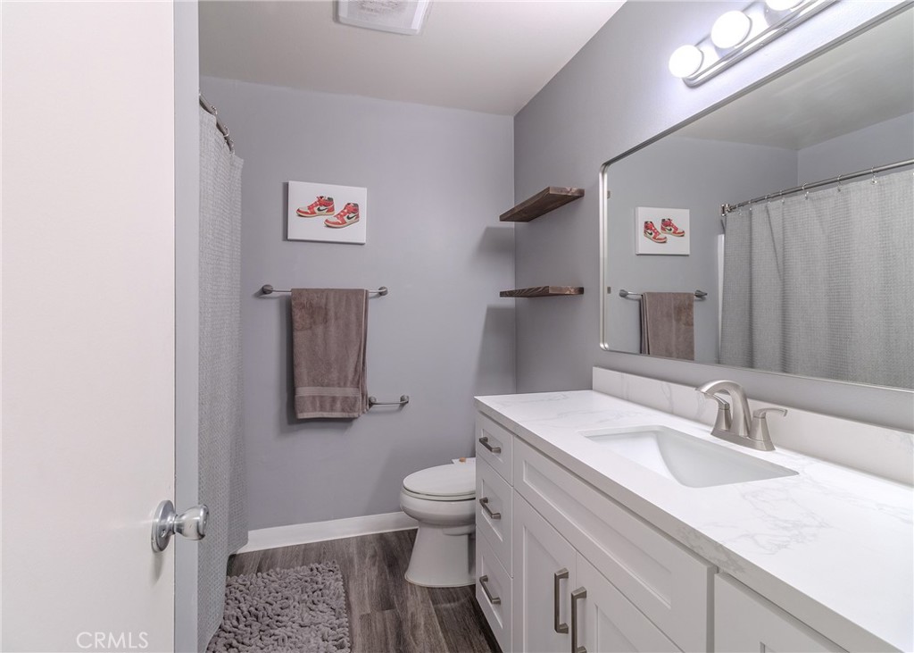 12200 Montecito Road, Unit D320 Seal Beach, CA 90740 - Photo 12 of 27 a bathroom with a sink and a mirror