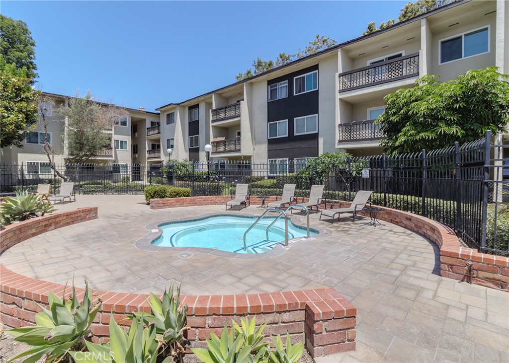 12200 Montecito Road, Unit D320 Seal Beach, CA 90740 - Photo 20 of 27 a view of backyard with swimming pool and outdoor seating