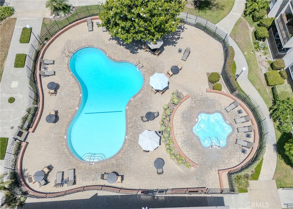 12200 Montecito Road, Unit D320 Seal Beach, CA 90740 - Photo 21 of 27 an aerial view of a swimming pool a fountain and a mirror