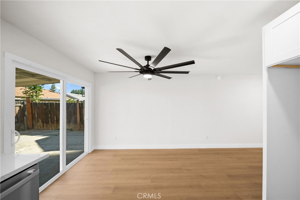 7931 Silverado Place Riverside, CA 92503 - Photo 18 of 35 a view of a livingroom with a ceiling fan and wooden floor