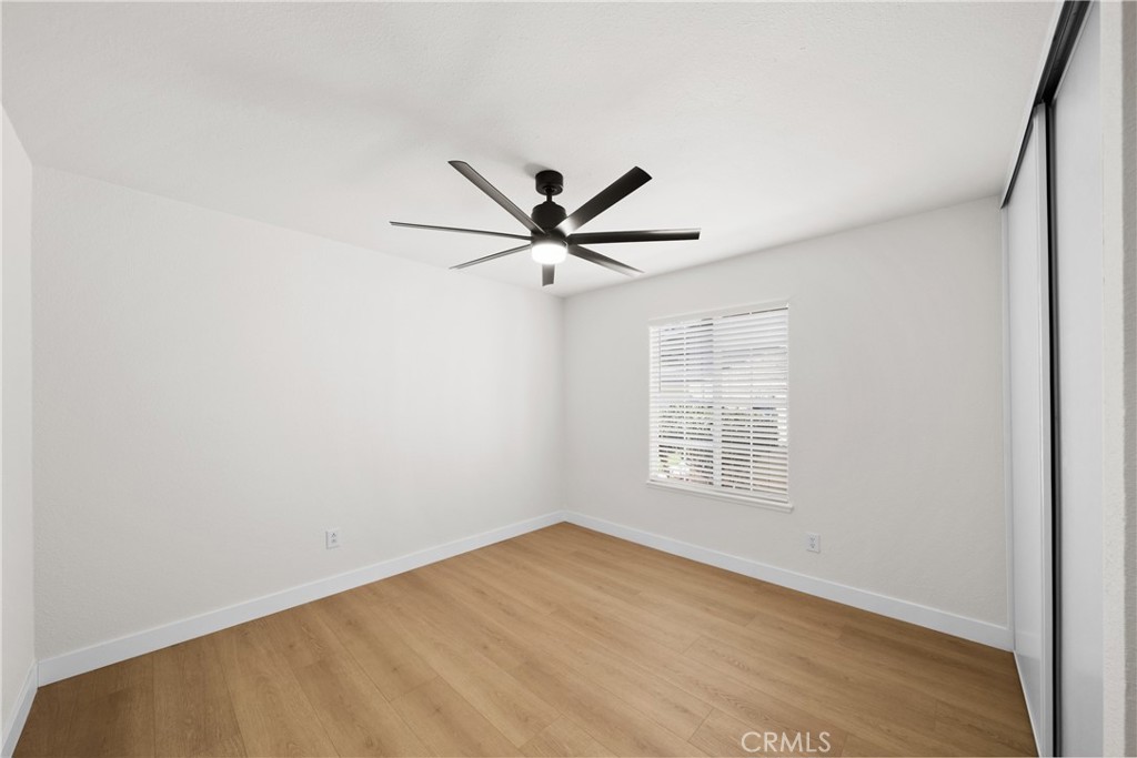 7931 Silverado Place Riverside, CA 92503 - Photo 26 of 35 an empty room with window and ceiling fan