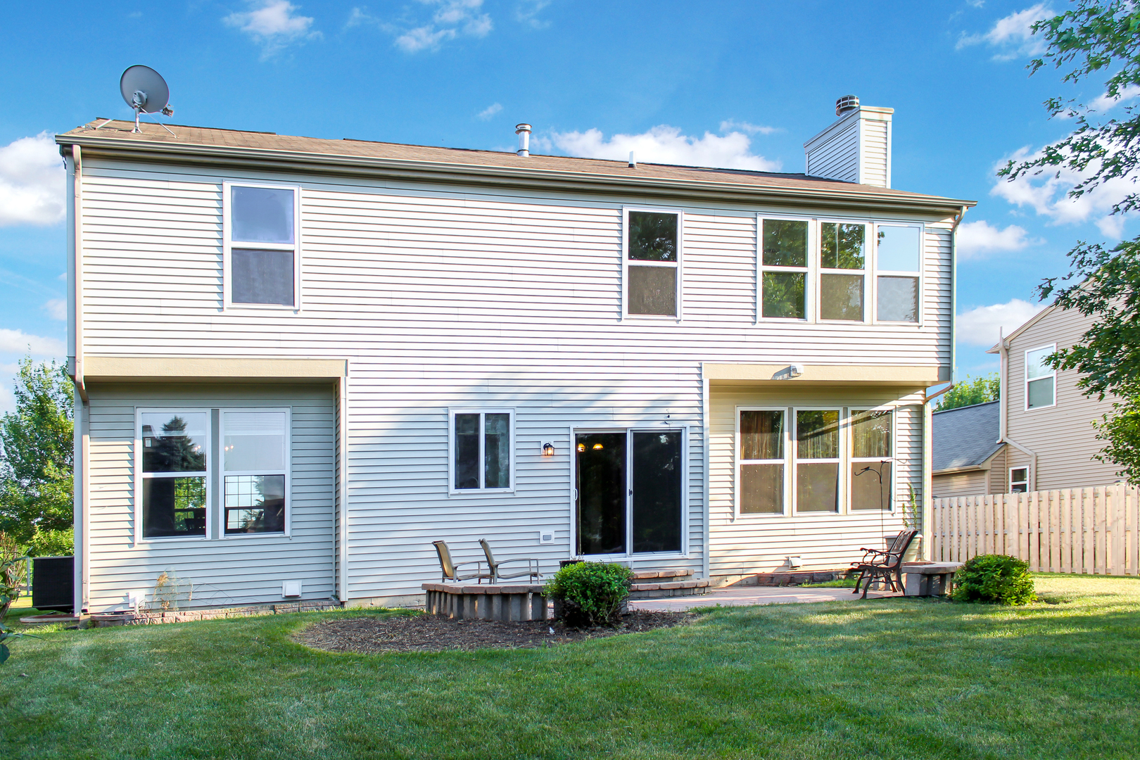 1546 Clear Drive Bolingbrook, IL 60490 - Photo 11 of 30 a front view of a house with a yard and garage