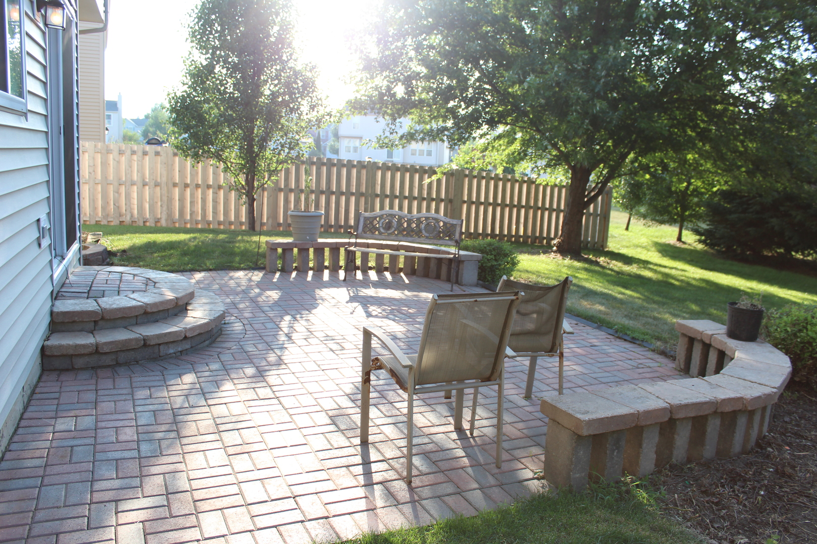 1546 Clear Drive Bolingbrook, IL 60490 - Photo 12 of 30 a view of a patio with a table chairs and a yard