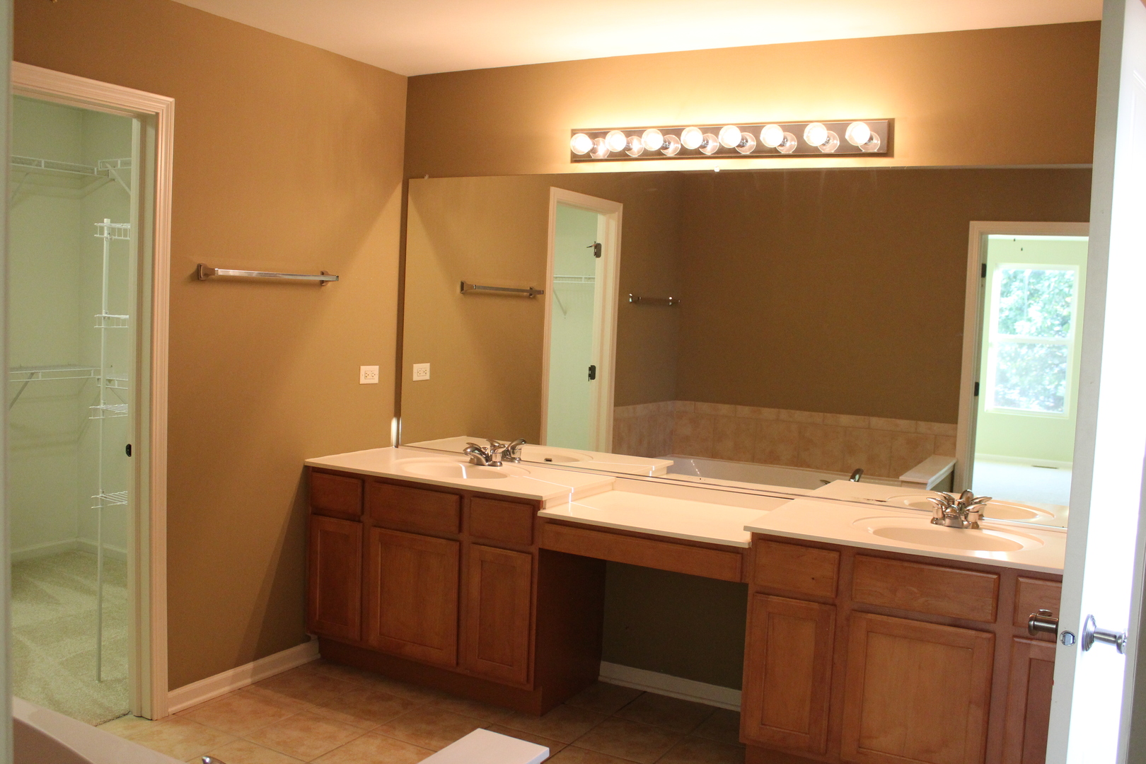 1546 Clear Drive Bolingbrook, IL 60490 - Photo 22 of 30 a bathroom with a granite countertop sink and a mirror