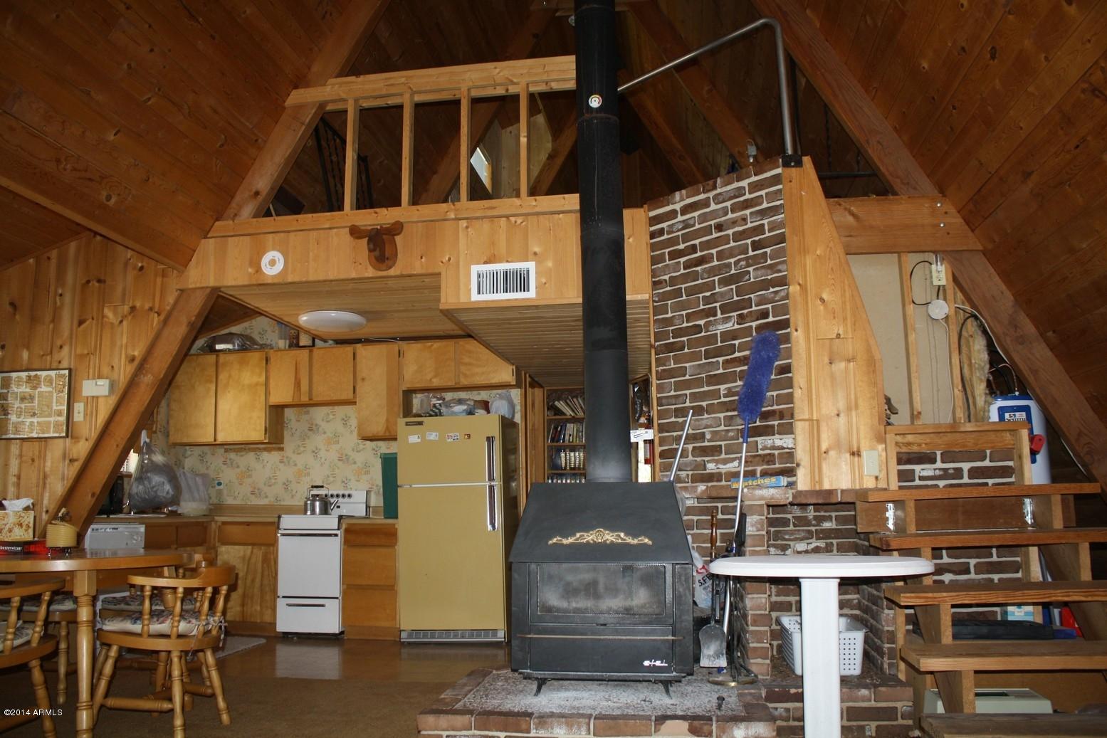 Spacious great room with wood stove