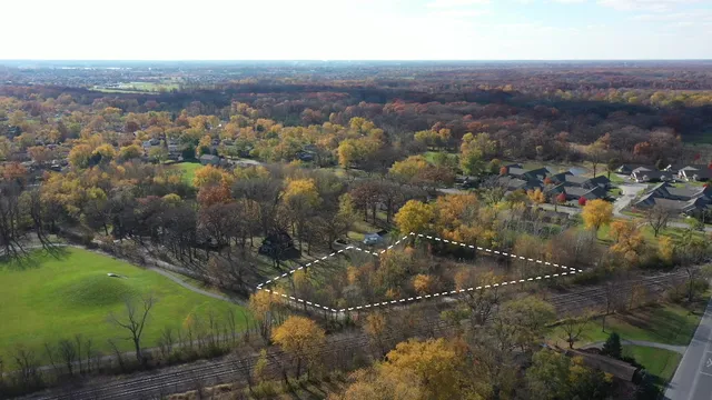 an aerial view of residential house with outdoor space and river