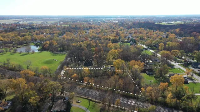 an aerial view of house with yard