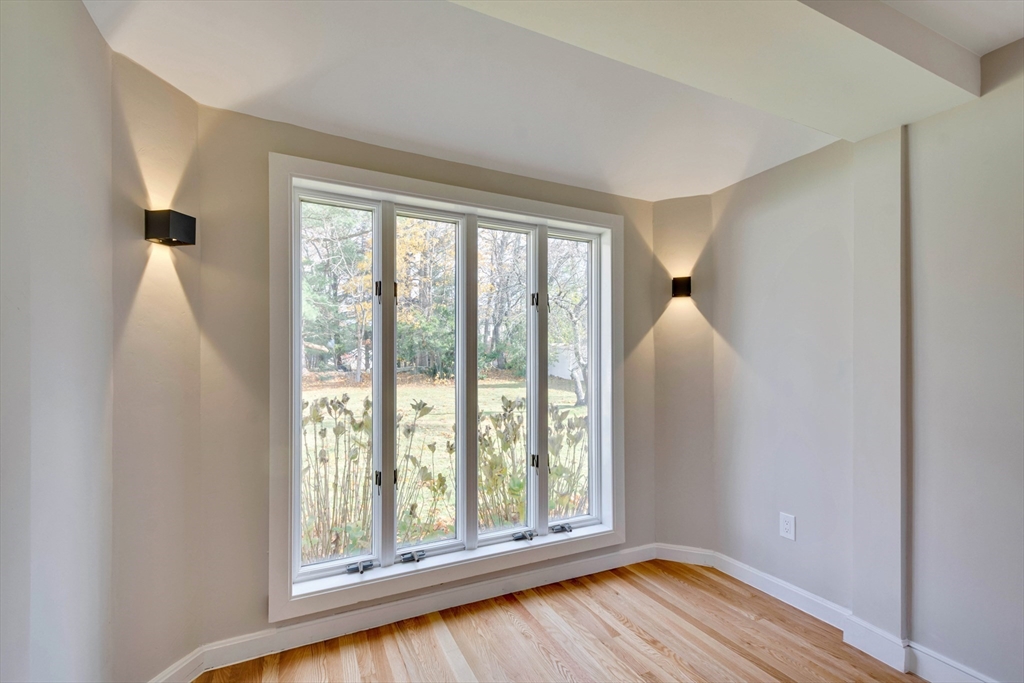 34 Irving Drive Walpole, MA 02081 - Photo 13 of 42 a view of an empty room with wooden floor and a window