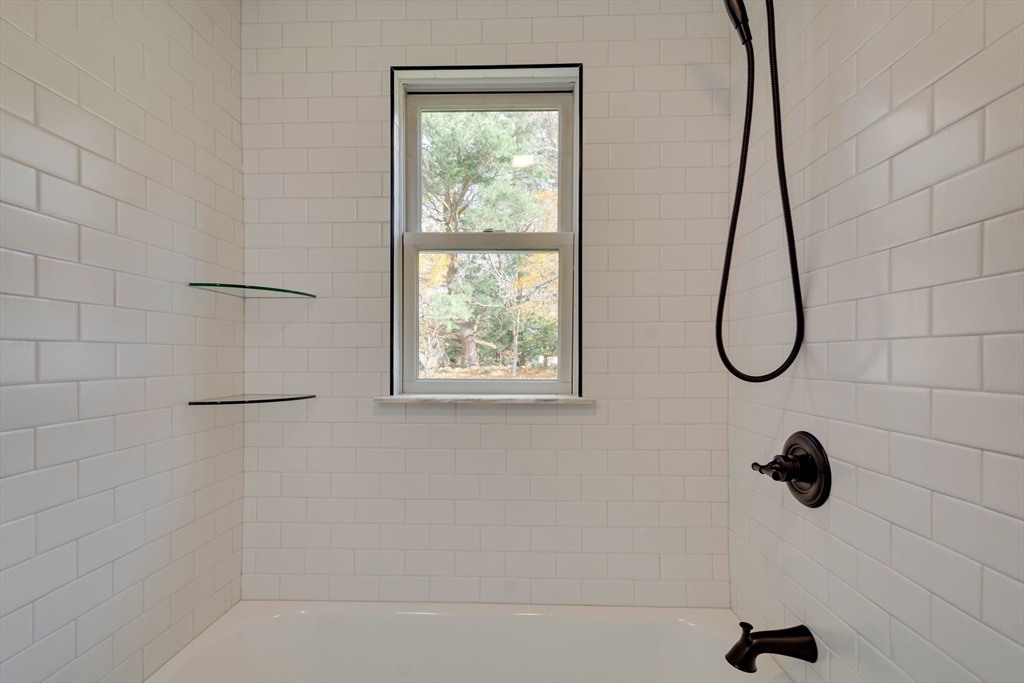 34 Irving Drive Walpole, MA 02081 - Photo 21 of 42 a bathroom with a bath tub with a shower