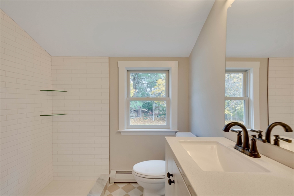 34 Irving Drive Walpole, MA 02081 - Photo 27 of 42 a bathroom with a sink a toilet and a window