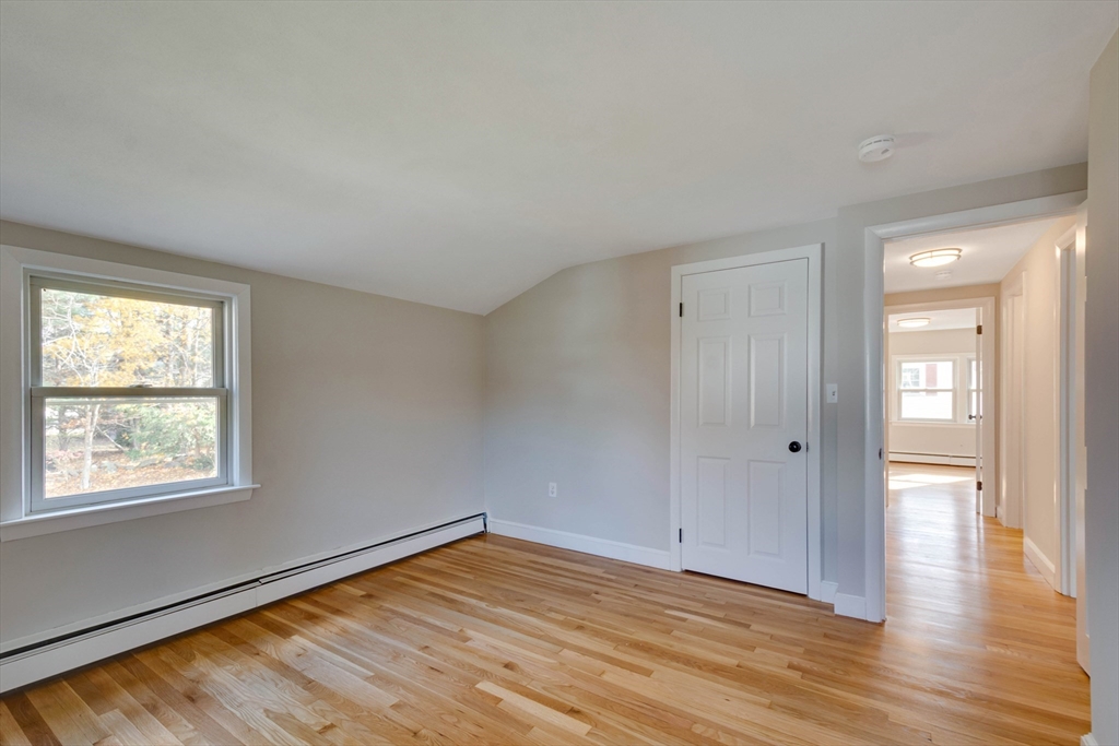 34 Irving Drive Walpole, MA 02081 - Photo 32 of 42 a view of empty room with wooden floor and fan