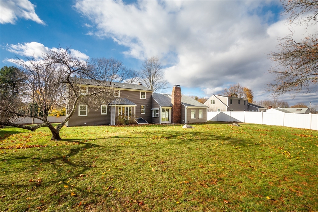 34 Irving Drive Walpole, MA 02081 - Photo 36 of 42 a front view of a house with a yard and lake view
