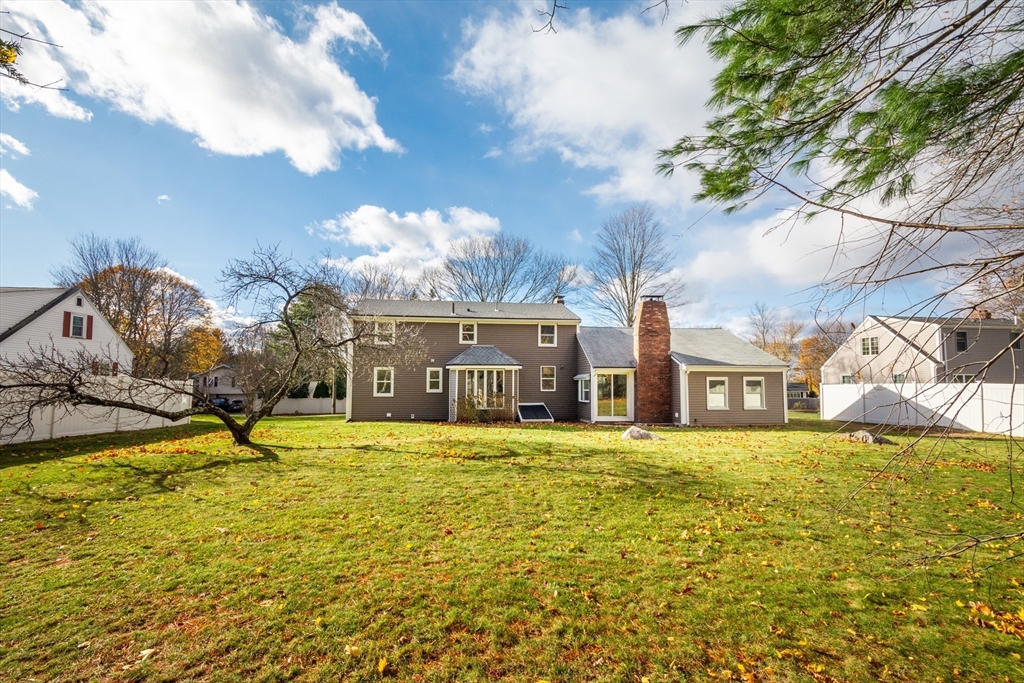 34 Irving Drive Walpole, MA 02081 - Photo 37 of 42 a view of a swimming pool with an outdoor space and seating area