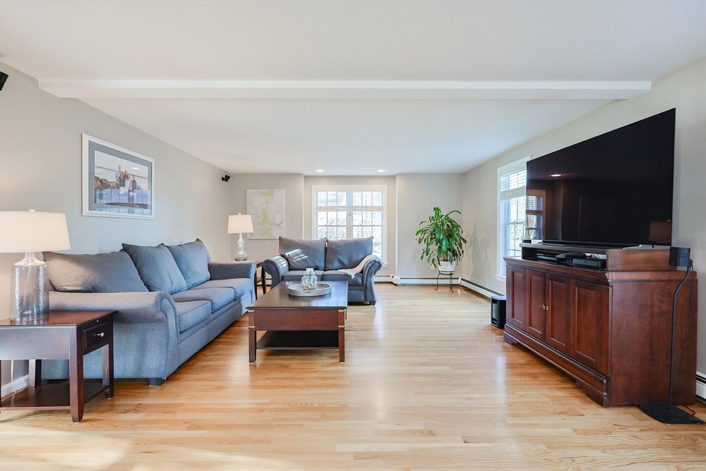 52 Quail Creek Road North Attleboro, MA 02760 - Photo 11 of 42 a living room with furniture and a flat screen tv