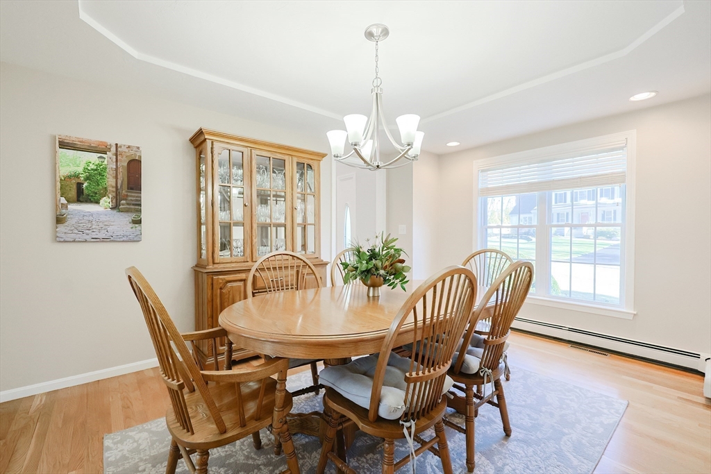 52 Quail Creek Road North Attleboro, MA 02760 - Photo 14 of 42 a view of a dining room with furniture window and outside view