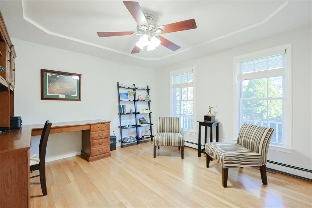 52 Quail Creek Road North Attleboro, MA 02760 - Photo 15 of 42 a living room with furniture and a wooden floor