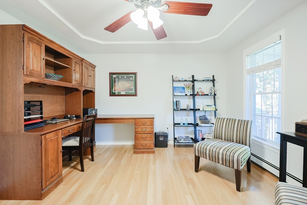 52 Quail Creek Road North Attleboro, MA 02760 - Photo 16 of 42 a living room with furniture fireplace and a window