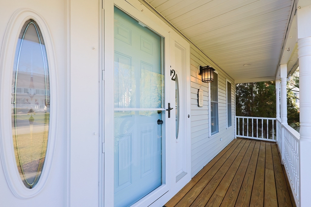52 Quail Creek Road North Attleboro, MA 02760 - Photo 2 of 42 a view of a balcony with wooden floor and door