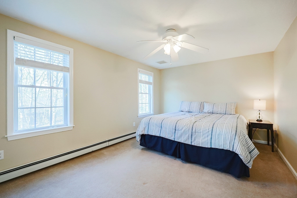52 Quail Creek Road North Attleboro, MA 02760 - Photo 22 of 42 a spacious bedroom with a bed and a window