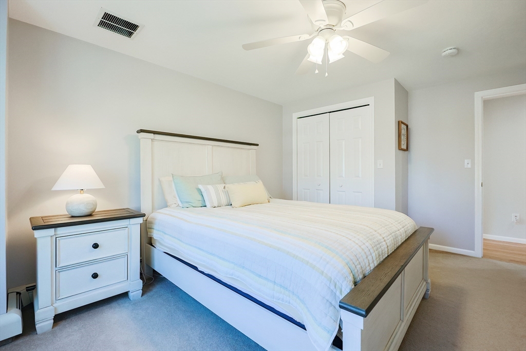 52 Quail Creek Road North Attleboro, MA 02760 - Photo 25 of 42 a bedroom with a bed and a lamp