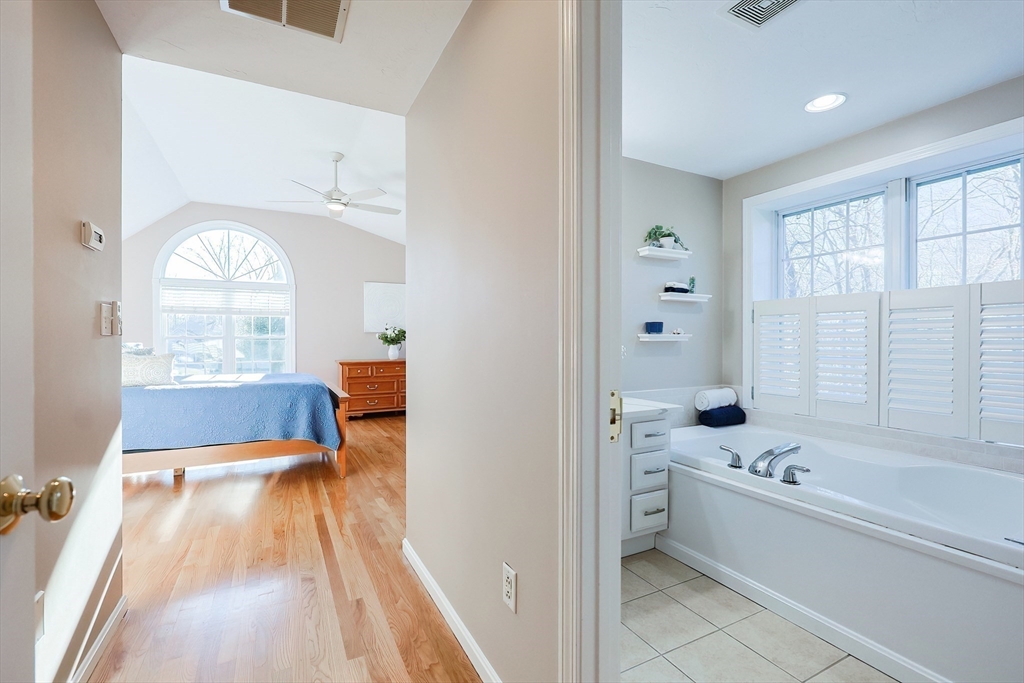 52 Quail Creek Road North Attleboro, MA 02760 - Photo 27 of 42 a en suite bathroom with a bathtub and a shower