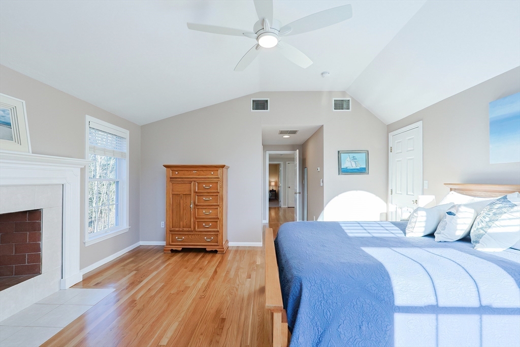 52 Quail Creek Road North Attleboro, MA 02760 - Photo 30 of 42 a bedroom with a bed and wooden floor