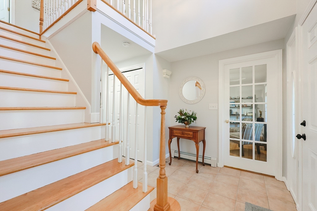 52 Quail Creek Road North Attleboro, MA 02760 - Photo 3 of 42 a view of staircase with white walls and a window