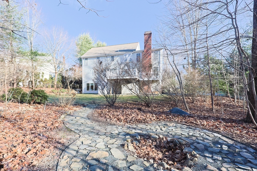 52 Quail Creek Road North Attleboro, MA 02760 - Photo 39 of 42 a view of a yard with plants and a trees