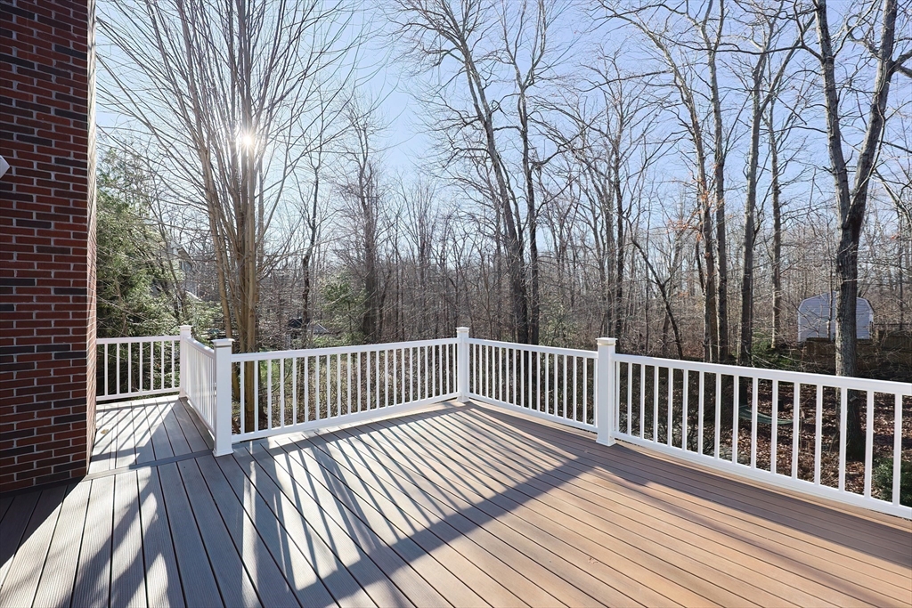 52 Quail Creek Road North Attleboro, MA 02760 - Photo 41 of 42 a view of balcony with wooden floor and fence