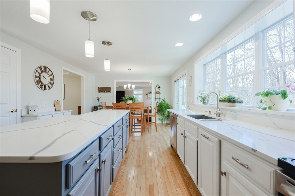 52 Quail Creek Road North Attleboro, MA 02760 - Photo 5 of 42 a kitchen with counter top space and painting on the wall