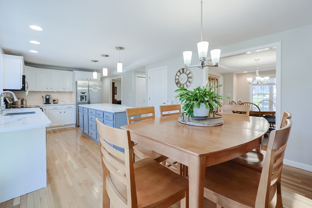 52 Quail Creek Road North Attleboro, MA 02760 - Photo 6 of 42 a view of a dining room with furniture and wooden floor