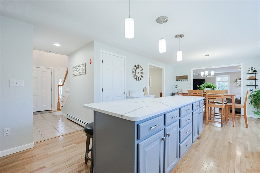 52 Quail Creek Road North Attleboro, MA 02760 - Photo 7 of 42 a kitchen with stainless steel appliances granite countertop counter space a sink refrigerator and wooden floor