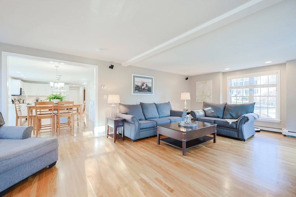 52 Quail Creek Road North Attleboro, MA 02760 - Photo 10 of 42 a living room with furniture and wooden floor
