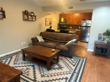 a living room with furniture and a rug
