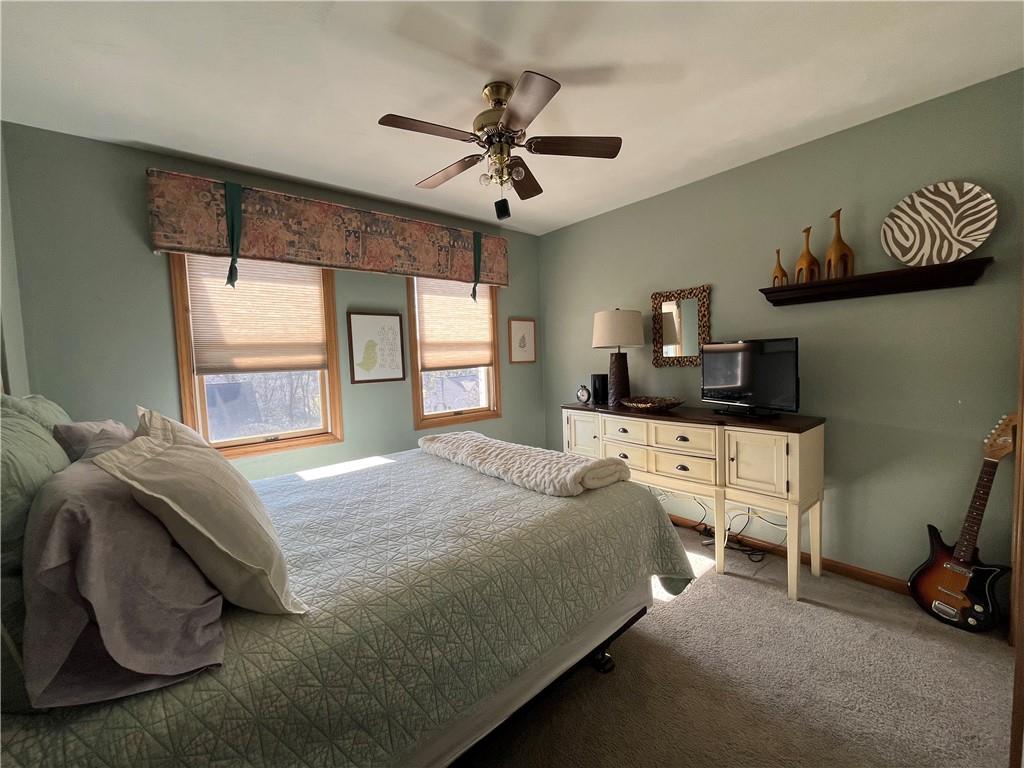 531 Cedar Glenn Drive Irwin, PA 15642 - Photo 36 of 50 a spacious bedroom with a bed a couch and a window