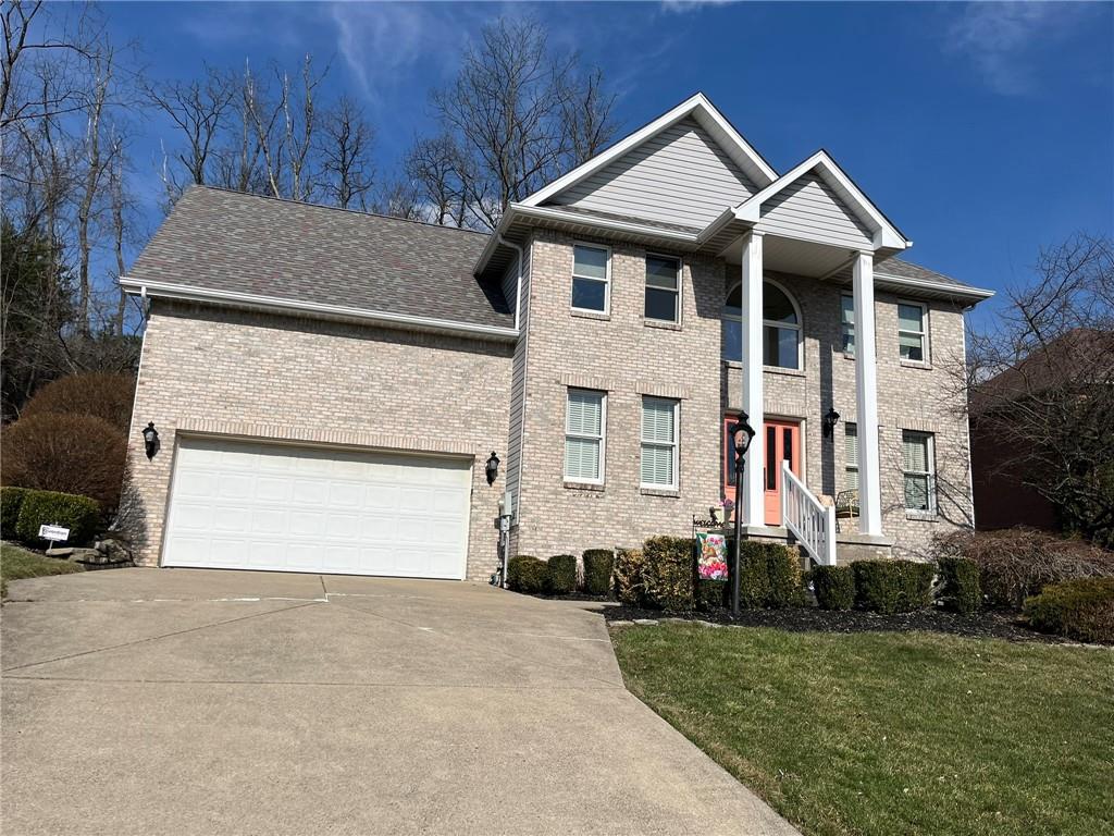 531 Cedar Glenn Drive Irwin, PA 15642 - Photo 50 of 50 a front view of a house with a yard and garage