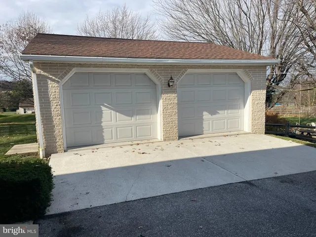 a view of house with backyard space