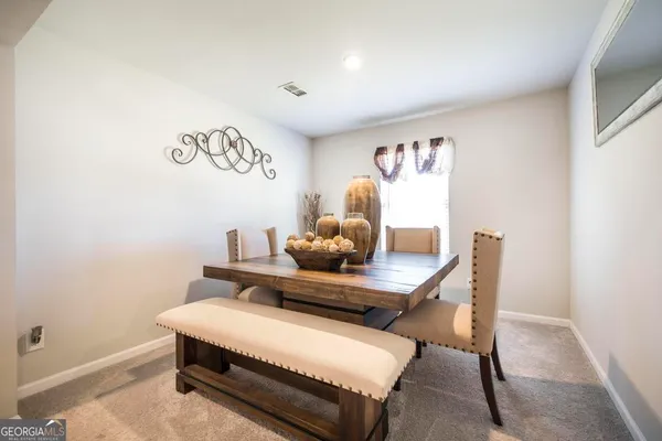 a living room with furniture and window