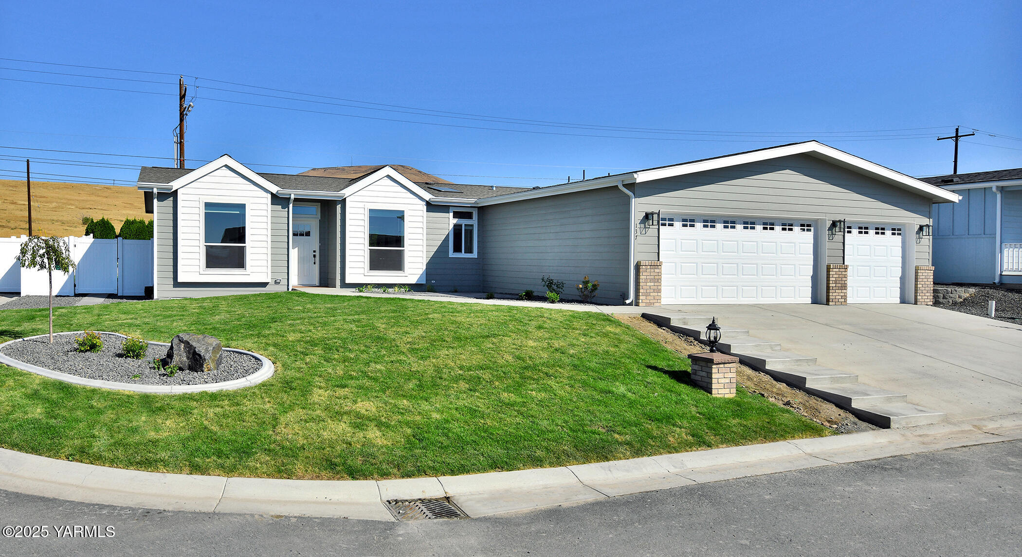 a front view of a house with a yard