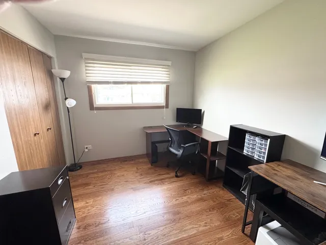 a bathroom with a sink and mirror with toilet