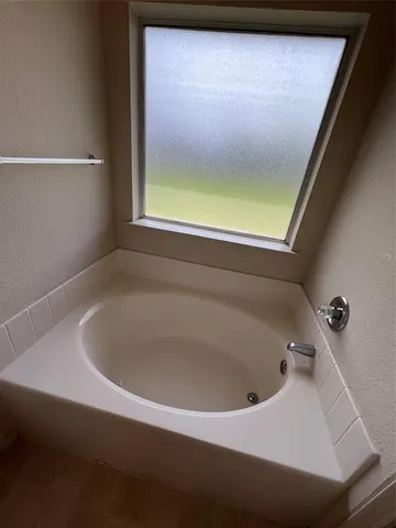 a bathroom with a shower and toilet