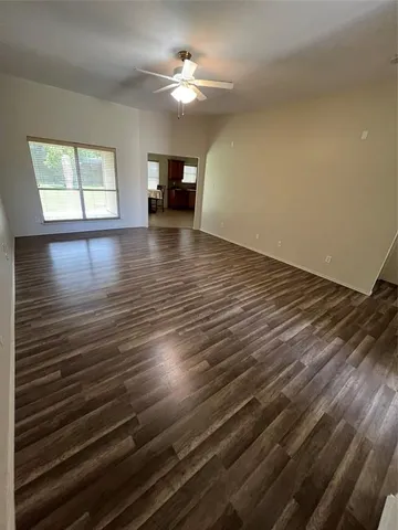 a view of an empty room and window