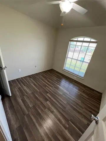 a view of an empty room and window