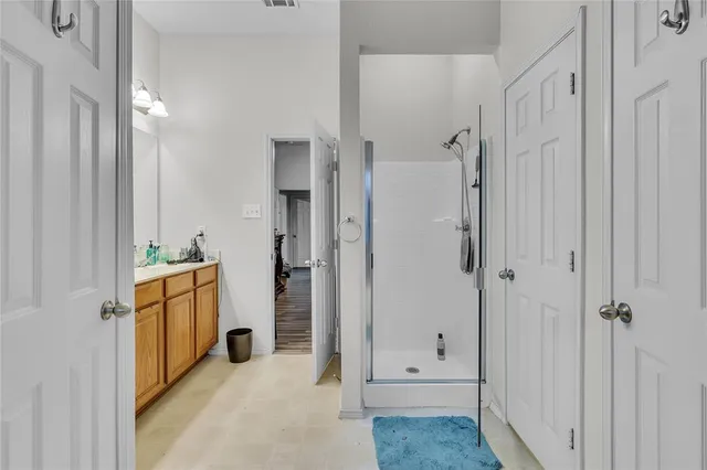 a spacious bathroom with a shower