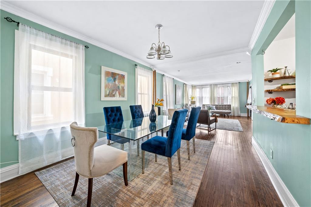 2806 Cortelyou Road Brooklyn, NY 11226 - Photo 2 of 13 a view of a dining room with furniture a chandelier and wooden floor