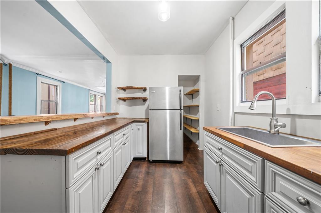 2806 Cortelyou Road Brooklyn, NY 11226 - Photo 5 of 13 a kitchen with a sink and a refrigerator