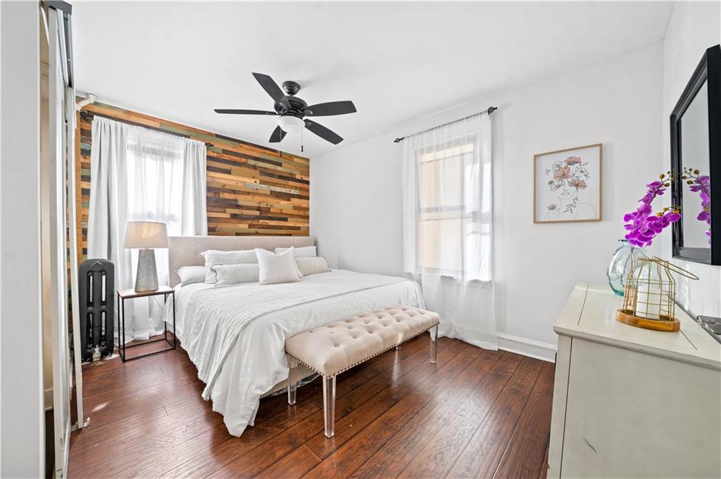 2806 Cortelyou Road Brooklyn, NY 11226 - Photo 7 of 13 a bedroom with a bed and a window