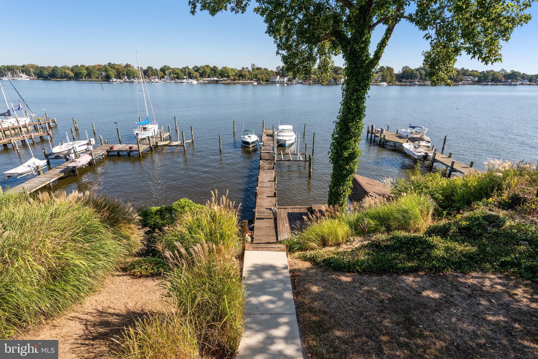 211 St Marys Road Baltimore, MD 21221 - Photo 20 of 50 a view of a lake with boats and trees in the background