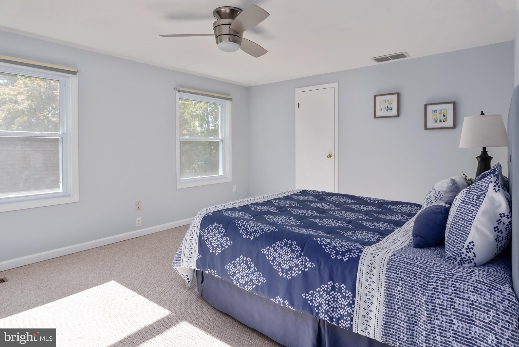 211 St Marys Road Baltimore, MD 21221 - Photo 39 of 50 a bedroom with a bed dresser and window