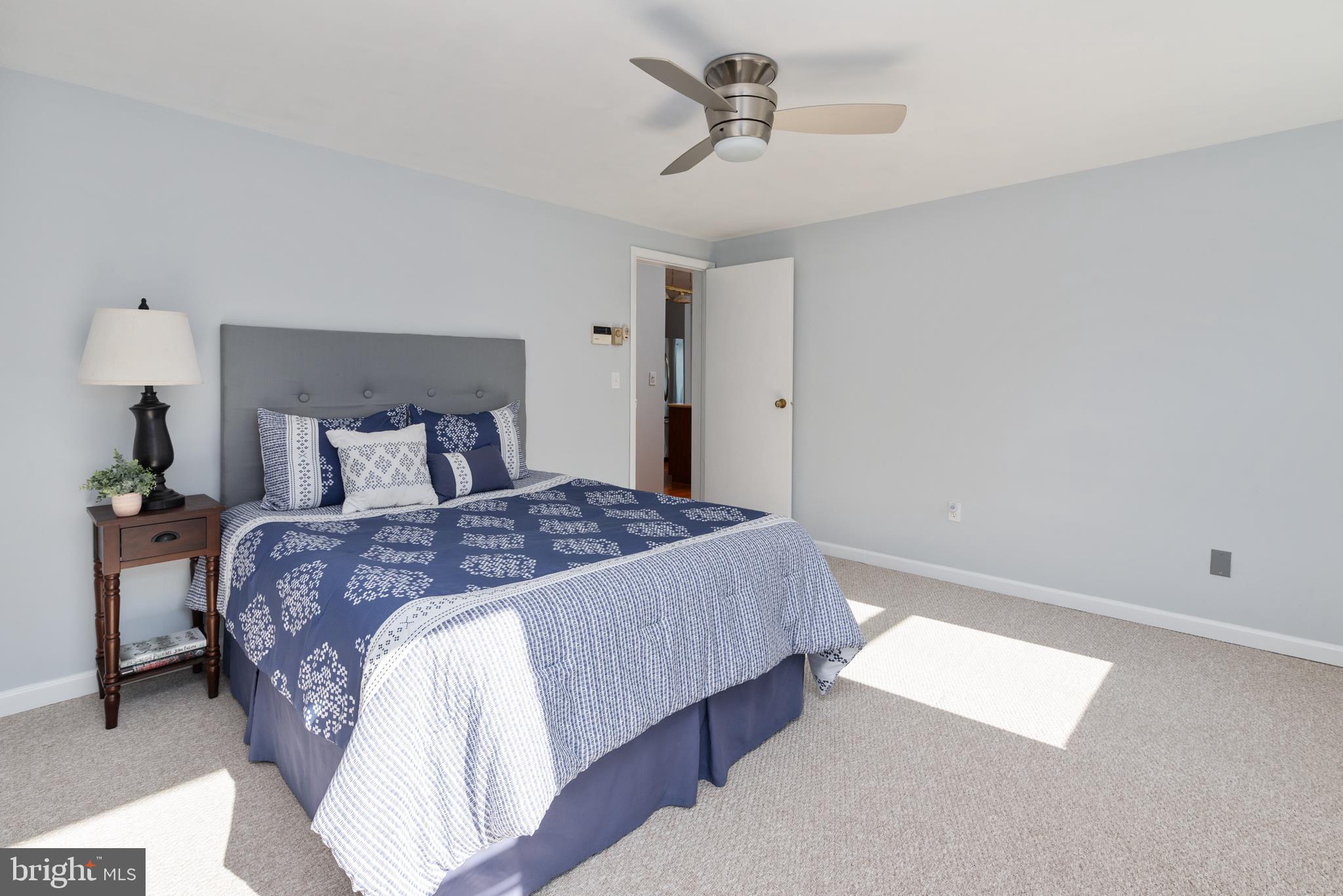 211 St Marys Road Baltimore, MD 21221 - Photo 40 of 50 a bedroom with a bed and a chandelier